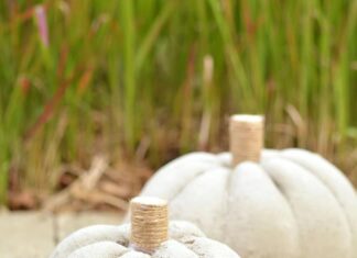 How to Make DIY Concrete Pumpkins for Fall Decor Two concrete pumpkins sitting outside