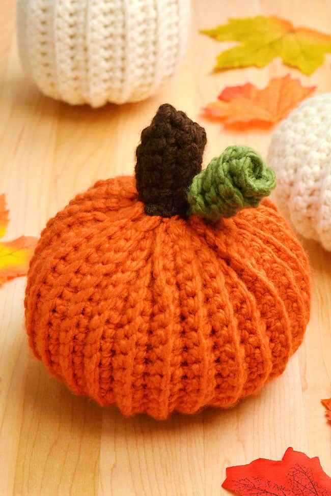 Orange crochet pumpkin made with a free, printable pattern