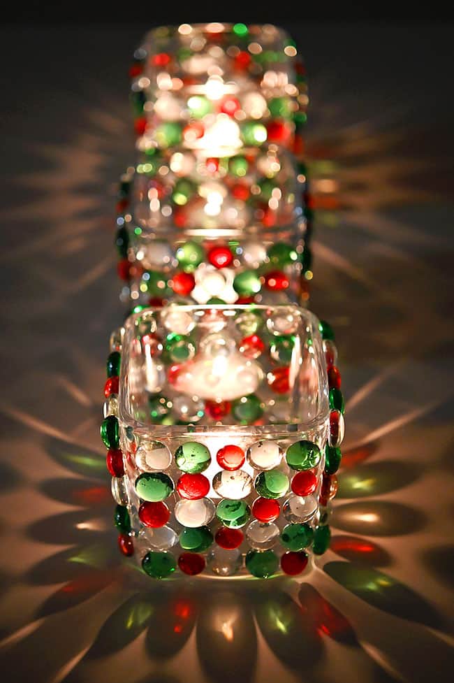 Beautiful reflections on the table from candles burning in DIY glass bead candle holders
