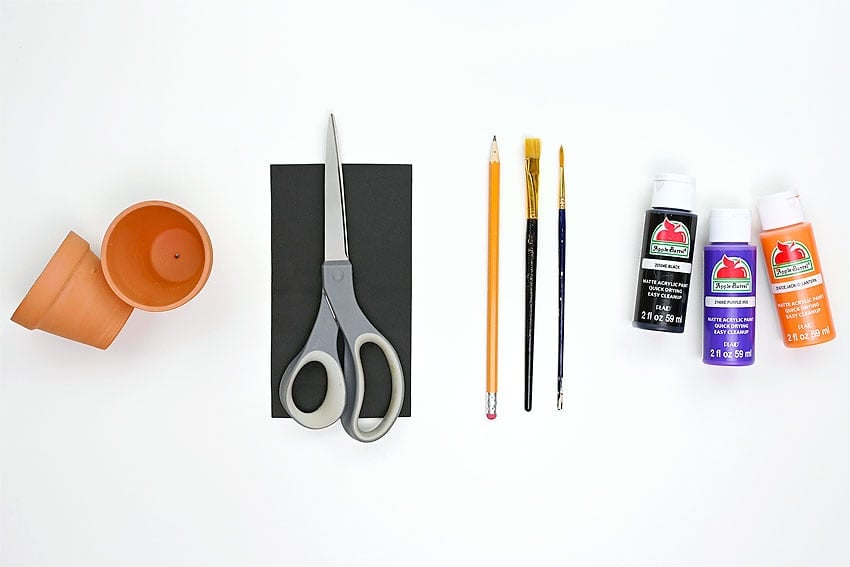Supplies for making painted Halloween clay pots