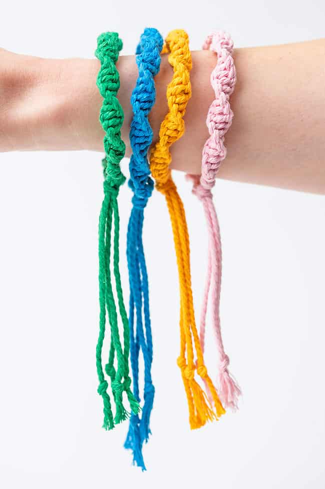 Macrame bracelets dangling from a wrist