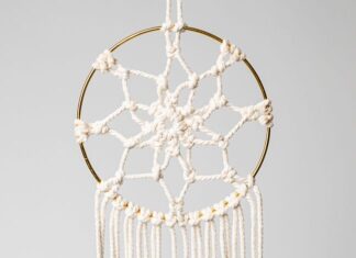 Macrame Dream Catcher Macrame dream catcher on a gold hoop with wooden beads