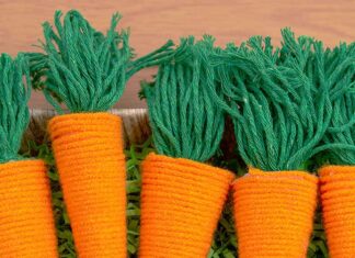 DIY Yarn Carrot Craft: Easy Easter Project Yarn wrapped carrots in a basket with Easter grass