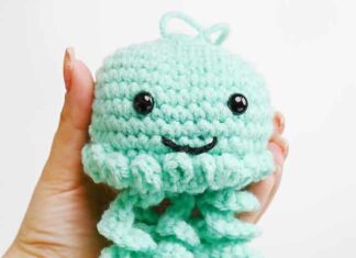 How to Crochet a Jellyfish: Step-by-Step Guide Holding a seafoam green crochet jellyfish