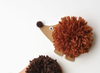 Pom Pom Hedgehogs Three pom pom hedgehogs on a white background
