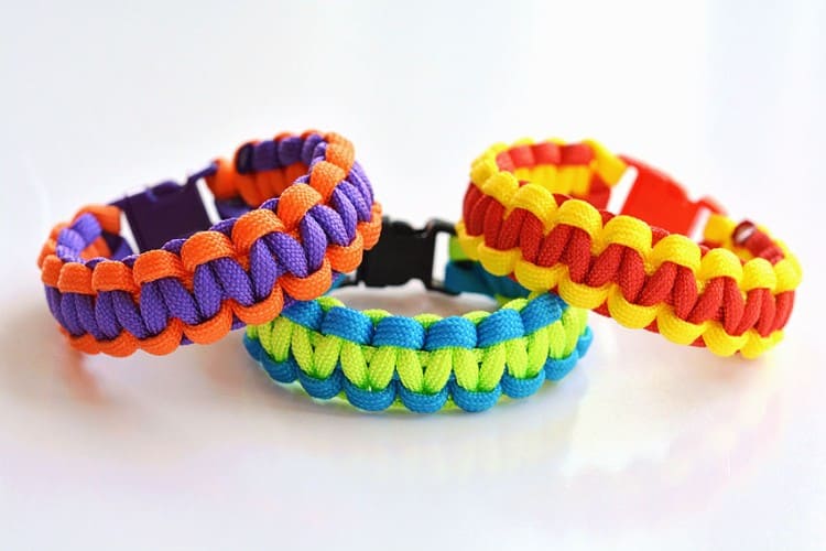 Three paracord bracelets on a white background
