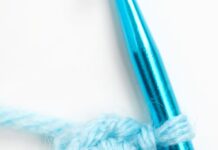 How to Crochet a Magic Circle: Beginner’s Guide Showing a magic circle with single crochet on a crochet hook