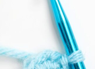 How to Crochet a Magic Circle: Beginner’s Guide Showing a magic circle with single crochet on a crochet hook