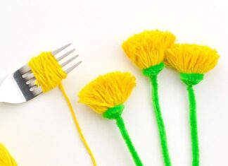 DIY Pom Pom Dandelions: Easy Craft Tutorial Use a fork to make a pom pom dandelion from yarn and a pipe cleaner