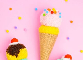 DIY Pom Pom Ice Cream Cones: Fun Summer Craft Pom pom ice cream cones decorated with whipped cream, cherries, and sprinkles