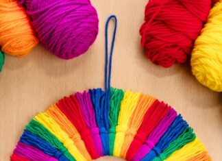 How to Make a Rainbow Tassel Wreath: DIY Craft Guide Rainbow tassel wreath made with colourful yarn