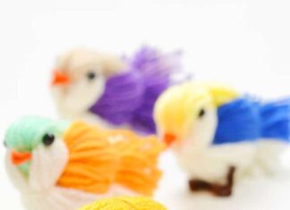 DIY Yarn Bird Craft: Easy Craft for Kids Group of DIY yarn birds on a white background