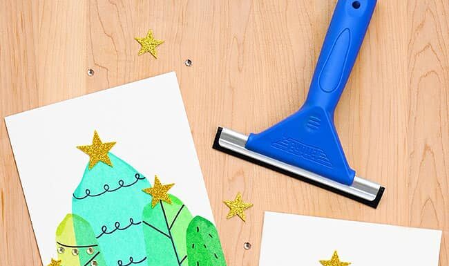 DIY Christmas Squeegee Painting: Unique Holiday Craft Idea Christmas trees on DIY cards painted with a squeegee