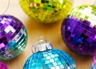 DIY Disco Ball Ornaments Disco ball ornament surrounded by other mirror ball ornaments