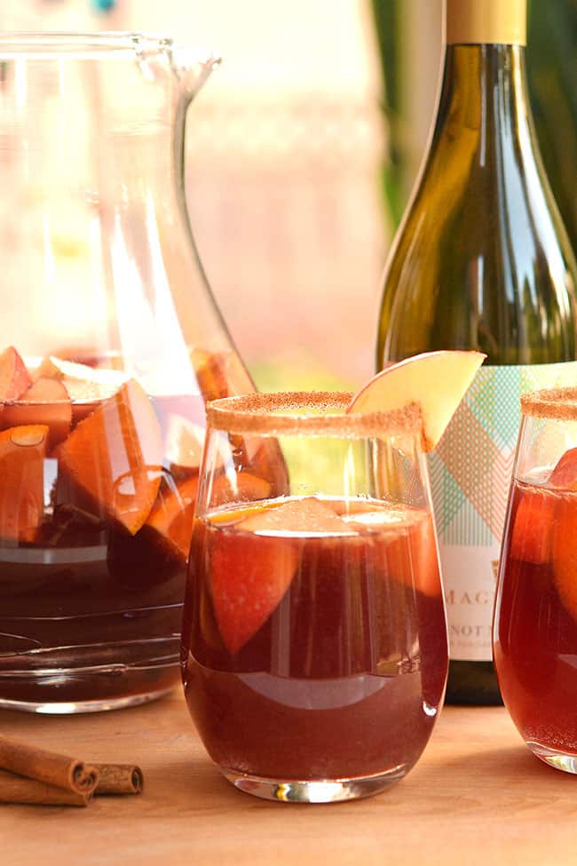 This recipe for autumn sangria is SO GOOD! Infused with apples and cinnamon, this simple red wine sangria recipe is fruity, festive and tastes delicious!