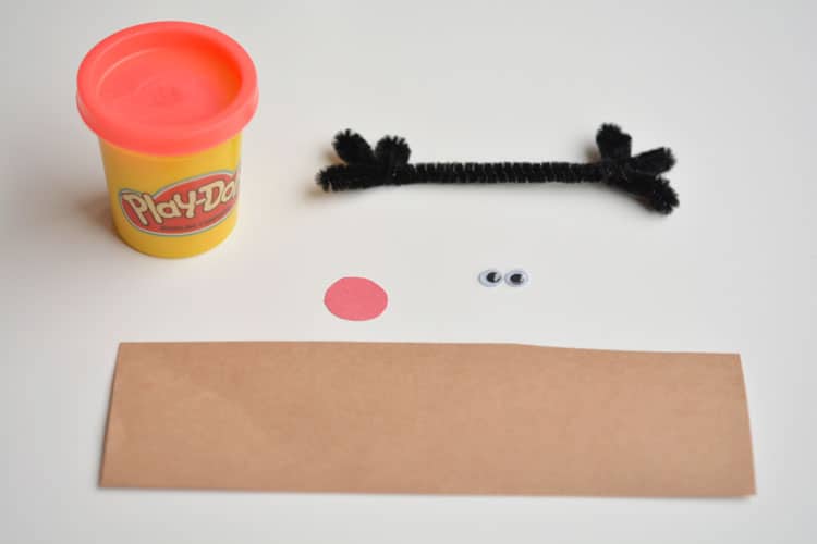 These easy Christmas Play-doh favours make ADORABLE little party gifts for kids! They're a great little non-candy Christmas treat idea too!