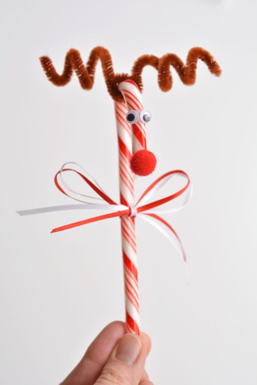 Do you remember making these Rudolph candy canes when you were a kid?! They're so cute and SO EASY! What a great holiday craft to do with the kids!