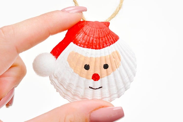 Seashell painted as Santa Claus