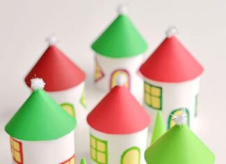 DIY Twinkling Paper Roll Christmas Village: A Festive Craft Idea This paper roll Christmas village is SO CUTE and it's really easy to make! Add a few battery operated tea lights and you can create a magical glowing village. This is such a cute Christmas decoration and a super fun Christmas craft to make with the kids.