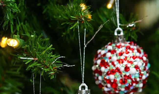 Rhinestone Christmas Ornaments Three rhinestone Christmas ornaments hanging on a Christmas tree