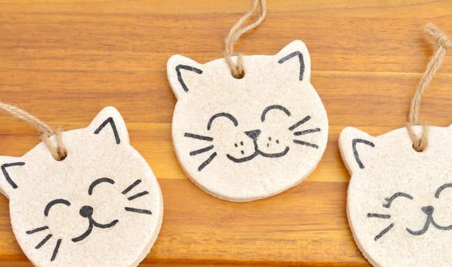 Salt Dough Cat Ornaments Painted salt dough cat ornaments on a wooden surface