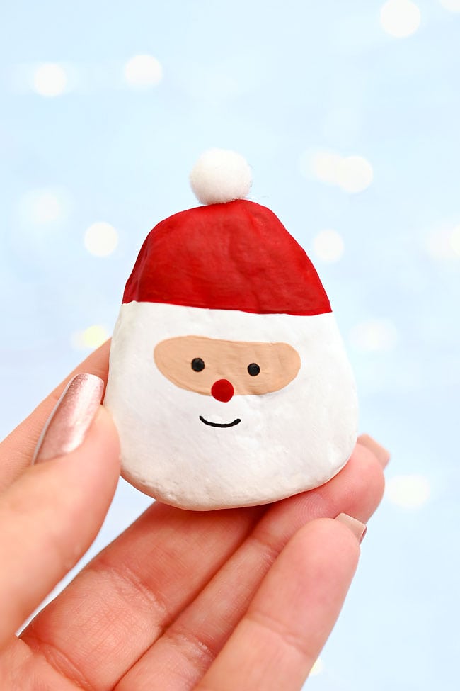 Holding a Santa painted rock