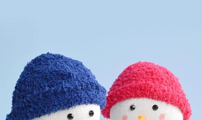 Sock Snowman Sock snowmen with hats and scarves