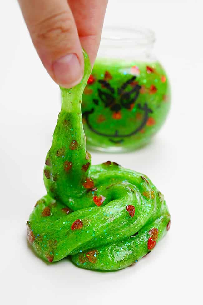 Easy Grinch Slime Craft Puddle of green glittery Grinch slime