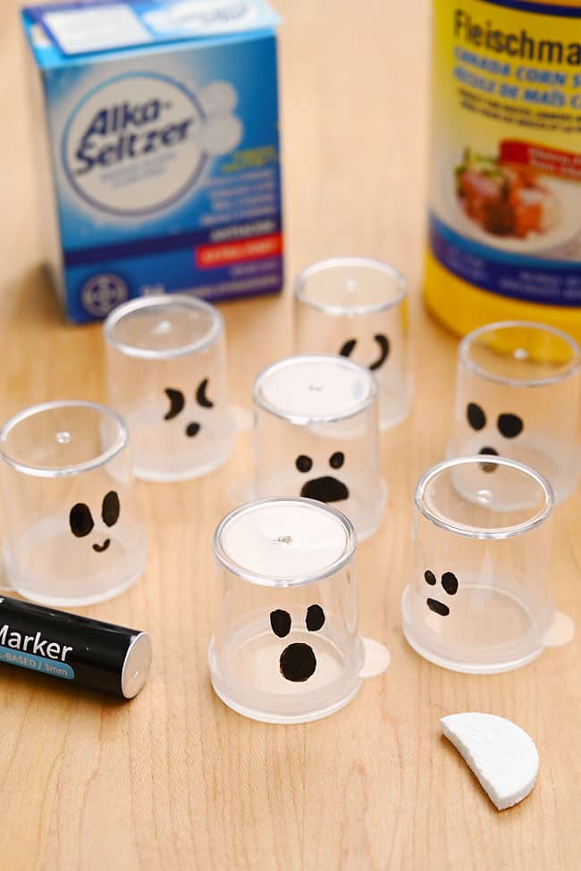 Ghost Rockets Alka Seltzer Containers with ghost faces and supplies to make Alka-Seltzer ghost rockets