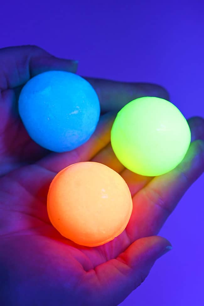 Glow in the Dark Bouncy Balls Holding colourful glow in the dark bouncy balls