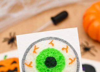 Halloween 3D Sponge Canvas – Spooky Art That Comes to Life! 3D eyeball drawing on sponge canvas with Halloween symbols in the background