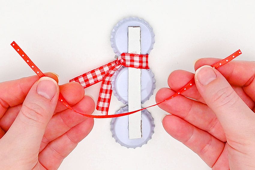 bottle cap snowman kids craft instruction image 17